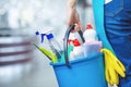 Cleaning lady holding a bucket of cleaning products in her hands Royalty Free Stock Photo