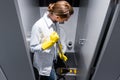 Cleaning lady or janitor mopping the floor in restroom Royalty Free Stock Photo