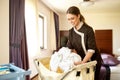 Cleaning lady managing a hotel room Royalty Free Stock Photo