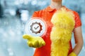 Cleaning lady shows a icon of well-done work on a blurred background Royalty Free Stock Photo