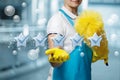 Cleaning lady with a smile on her face shows five star service Royalty Free Stock Photo