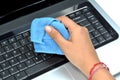 Cleaning laptop keyboard Royalty Free Stock Photo