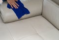 Cleaning leather sofa Royalty Free Stock Photo