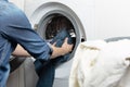 Cleaning and loading white washing machine Royalty Free Stock Photo