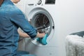 Cleaning and loading white washing machine Royalty Free Stock Photo