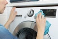 Cleaning and loading white washing machine Royalty Free Stock Photo