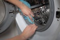 Cleaning and loading white washing machine