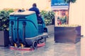 Cleaning machine for sanitation in the supermarket. Behind the wheel cleaner
