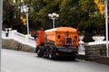 Cleaning machine washes asphalt road surface the city street Royalty Free Stock Photo