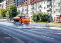 Cleaning machine washing the city asphalt road with water spray Royalty Free Stock Photo