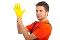 Cleaning man putting latex glove