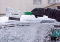 Cleaning the snow from car