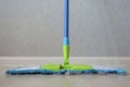 Cleaning mop with dust on bedroom wooden floor