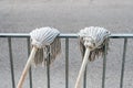 Cleaning mop, two cleaning mops hanging to dry