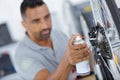 cleaning and oiling bicycle chain and gear with oil Royalty Free Stock Photo