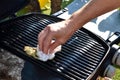 Cleaning the outdoor grill Royalty Free Stock Photo