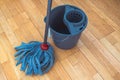 Cleaning parquet floor with rope mop Royalty Free Stock Photo