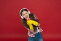 Cleaning party. Girl wear headphones and protective gloves for cleaning. Listening music and cleaning house. Having fun Royalty Free Stock Photo