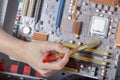 Cleaning the PC cleaning the motherboard from dust using a brush Royalty Free Stock Photo