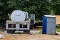 Cleaning portable restrooms with the help of a septic truck Royalty Free Stock Photo