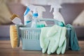 Cleaning, products and basket on table in home living room for spring cleaning. Hygiene, cleaning supplies and Royalty Free Stock Photo