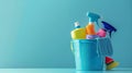 Cleaning products in bucket on blue background Royalty Free Stock Photo