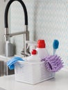 Cleaning products for cleaning, disinfection at home in a basket in kitchen.