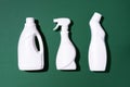 Cleaning products on green background. Top view. Copy space. Chemical cleaning supplies. Stop plastic, recycling