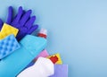 Cleaning products and tools on a blue background, with space for text Royalty Free Stock Photo