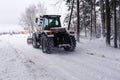 Cleaning the road from the snow. Forest in winter. Real is beautiful Royalty Free Stock Photo