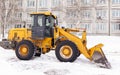 Cleaning and cleaning of roads in the city from snow in winter Royalty Free Stock Photo