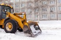 Cleaning and cleaning of roads in the city from snow in winter Royalty Free Stock Photo