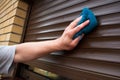 Cleaning roller shutters Royalty Free Stock Photo