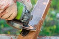 Cleaning rust on steel closed profile using an electric wheel grinding machine