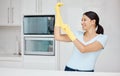 Cleaning, safety and sanitizing with a woman cleaner in rubber gloves ready to do chores and house work. Hygiene, clean Royalty Free Stock Photo