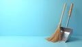 Cleaning scoop and broom on blue background Royalty Free Stock Photo