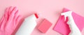 Cleaning service banner mockup. Flat lay house cleaning supplies on pink background. Top view cleaner spray bottle, rag, sponge,