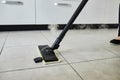 Cleaning service company employee removing dirt from carpet in flat with professional steam cleaner equipment close up Royalty Free Stock Photo