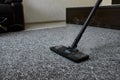 Cleaning service company employee removing dirt from carpet in flat with professional steam cleaner equipment close up Royalty Free Stock Photo