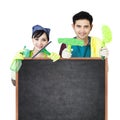 Cleaning service couple holding blackboard