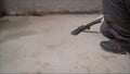 Cleaning service. dust removal with vacuum cleaner. A worker removes building dust with a vacuum cleaner. Concrete floor Royalty Free Stock Photo