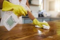 Cleaning service, hands and dust on table as cleaner sprays kitchen counter or dirty furniture at home. Hands, worker Royalty Free Stock Photo