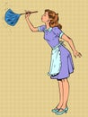 Cleaning service for a house or apartment. Housewife cleaning her space. A girl in uniform wipes the dust with a special