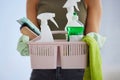 Cleaning service, product basket and cleaner hands for house work, office or home with plastic bottle, product and cloth