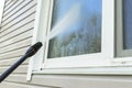 Cleaning service washing building facade and window with pressure water. Cleaning dirty wall with high pressure water jet. Power w Royalty Free Stock Photo