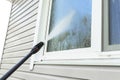 Cleaning service washing building facade and window with pressure water. Cleaning dirty wall with high pressure water jet. Power w Royalty Free Stock Photo