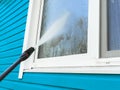 Cleaning service washing building facade and window with pressure water. Cleaning dirty wall with high pressure water jet. Power w Royalty Free Stock Photo