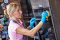 Cleaning service. woman clean cooker at kitchen