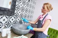 Cleaning service. woman clean washbowl at bathroom Royalty Free Stock Photo