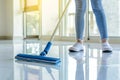 Cleaning Service Woman Mopping The Floor In Kitchen At Home